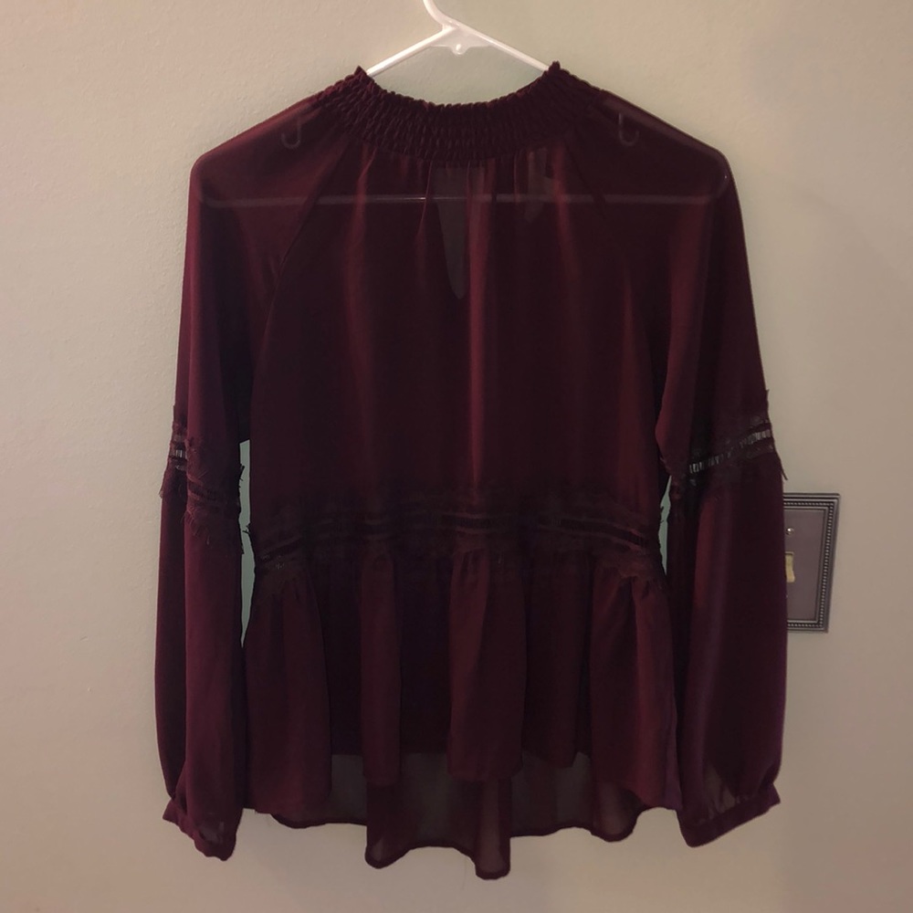 Sheer maroon blouse with lace details